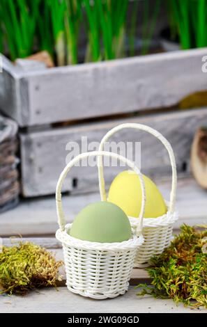 Eggs in wicker baskets, easter decoration Stock Photo