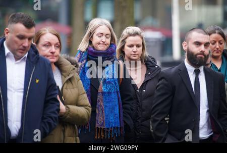 Brianna Ghey's (centre) mother Esther Ghey arrives at Manchester Crown Court as a boy and a girl, both 16, are due to be sentenced and named for the murder of teenager Brianna Ghey in a park in Culcheth, near Warrington. Brianna, 16, was stabbed with a hunting knife 28 times in her head, neck, chest and back after being lured to Linear Park on the afternoon of February 11 last year. Picture date: Friday February 2, 2024. Stock Photo