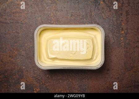 Titel	 Just opened margarine box on the Table. Seen direktly above Stock Photo