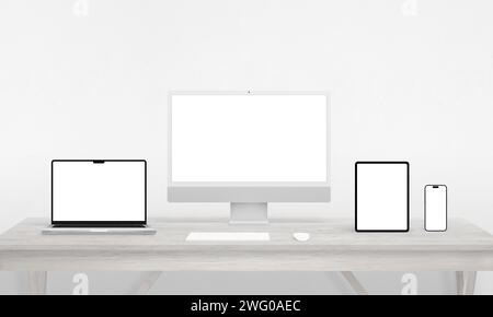 Responsive devices display on a work desk – computer, phone, tablet, laptop. Isolated screens ideal for mockups, showcasing app or web page presentati Stock Photo