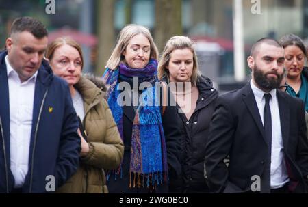 RETRANMITTING AMENDING CAPTION INFORMATION Brianna Ghey's mother Esther Ghey (centre) arrives at Manchester Crown Court as a boy and a girl, both 16, are due to be sentenced and named for the murder of teenager Brianna Ghey in a park in Culcheth, near Warrington. Brianna, 16, was stabbed with a hunting knife 28 times in her head, neck, chest and back after being lured to Linear Park on the afternoon of February 11 last year. Picture date: Friday February 2, 2024. Stock Photo