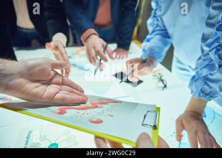 Marketing department, Colleagues, project managers working on promotional strategy, checking analytical graphs, data and KPI Stock Photo