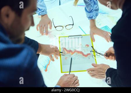 Marketing department, Colleagues, project managers working on promotional strategy, checking analytical graphs, data and KPI Stock Photo