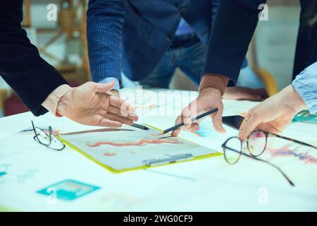Marketing department, Colleagues, project managers working on promotional strategy, checking analytical graphs, data and KPI Stock Photo