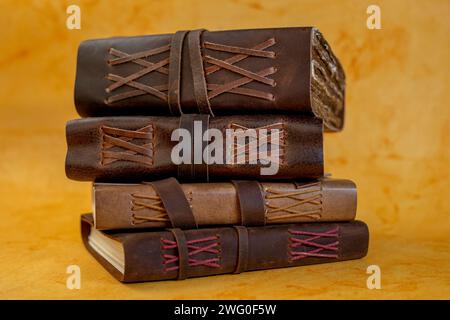stack of leather bound journals old and vinatge Stock Photo