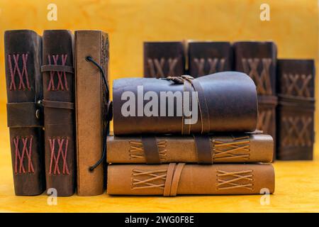 stack of leather bound journals old and vinatge Stock Photo