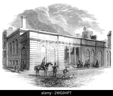 New Receiving Room at St. Bartholomew's Hospital, West Smithfield, [London], 1862. The '...new hall or receiving-room...is seen externally as a continuation of the facade of the original front...The approach to this hall is by a short colonnade...From this colonnade there are two doors of exit and entrance - one for males, the other for females. On entering this unpretending portal or portals, we are struck with the immense size of the room, its dimensions being nearly 100ft. long and about 35ft. wide. In this hall the public are permitted to receive medical and surgical aid without introducti Stock Photo