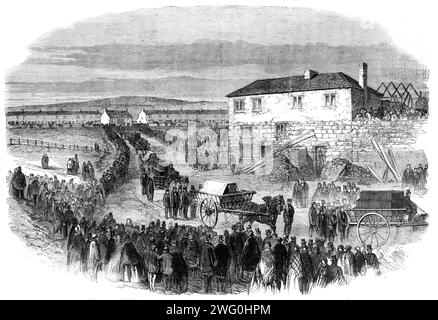The New Hartley Pit Calamity: the funeral procession leaving Colliery Row for Earsdon Churchyard, 1862. The Hartley Colliery disaster of 16 January 1862 was a coal mining accident in Northumberland which resulted in the deaths of 204 men and children. '...there were probably 60,000 persons present...carts containing a layer of straw were slowly driven to the door of each cottage, and, amid the weeping and still more agonising signs of silent grief in every sorrowstricken house, the coffins were lifted over the side of the cart and packed in loads of five each...[by] three o'clock, nearly all t Stock Photo