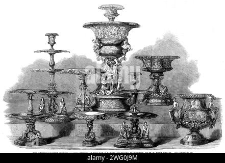 The International Exhibition: the Queen's Dessert Service, manufactured at the Royal Porcelain Works, Worcester, by W. H. Kerr, 1862. 'This costly service...is unique in its application of colour to enamels, enamel decoration to a service, and the general treatment of the design...the costliness and difficulty of production was immensely increased by no device being repeated, while each plate contains five subjects, and for the plates alone upwards of four hundred designs have been made. Painted enamels, ever since their introduction in the fifteenth century, have been greatly esteemed, and ha Stock Photo