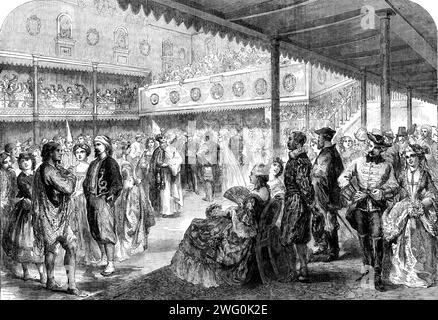The Preston Guild Festival: costume ball in the Guild Assembly Room, 1862. 'The ball took place on Friday in the fine centre hall of the Corn Exchange, which was tastefully fitted up for the occasion. There was a good display of the rank, wealth, and beauty of the county, the farfamed Lancashire witches appearing in irresistible force. A list of the guests and their respective characters occupies four columns of the local papers. It was a splendid sight. About 500 ladies and gentlemen, attired in brilliant and fantastic costumes, filled the hall and mingled in the mazy dance, Costumes were ado Stock Photo