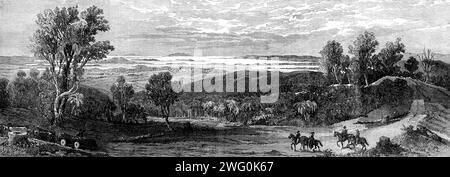 The Firth of the Thames, Waitemata, and Tamaki, and Gulf of Hauraki, Auckland, New Zealand, as seen from the Howick Ranges - from a drawing by Major Stack, 1862. View after a sketch by 'Frederick R. Stack, late Major of Brigade at Auckland,...overlooking the pensioner settlement of Howick...The road in the foreground is at the entrance to the forest leading to the Wairoa Valley. The forest trees are chopped down, sawn into logs of the required length, and conveyed to sawpits on wooden trucks drawn by teams of oxen. Land in such localities, being difficult of access, in consequence of its hilly Stock Photo