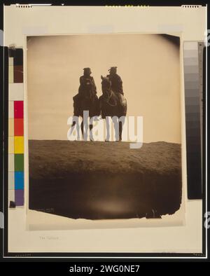 The outlook, c1904. Two native American men mounted on horses, gazing off into the distance. Stock Photo