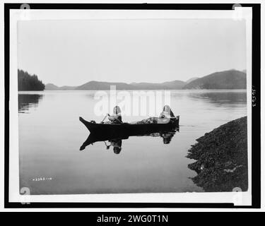 Canoeing on Clayquot Sound, c1910. Stock Photo