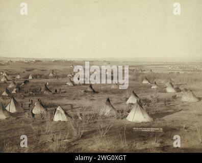 The Great Hostile Camp, 1891. Bird's-eye view of a Lakota camp (several tipis and wagons in large field) probably on or near Pine Ridge Reservation. Stock Photo