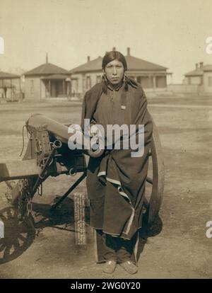 Tasunka, Ota (alias Plenty Horse[s]), the slayer of Lieut Casey, near Pine Ridge, SD, 1891. Plenty Horses, Oglala man, three-quarter length portrait, seated, facing front, with a blanket wrapped around his shoulders, probably on or near Pine Ridge Reservation. Stock Photo