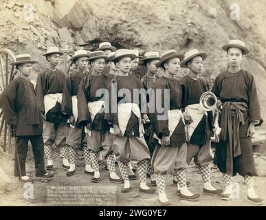 Hose team. The champion Chinese Hose Team of America, who won the great Hub-and-Hub race at Deadwood, Dak., July 4th, 1888 []. Twelve member team of Chinese &quot;&quot;hose&quot;&quot; runners posed in uniform. Stock Photo