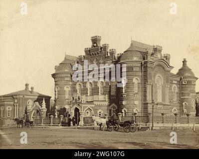 Irkutsk Museum, 1880-1889. From an album of photographs and prints showing highlights of the city of Irkutsk and its surrounding region in the late 19th century. Irkutsk was at that time the center of Siberian cultural and intellectual life. The buildings shown include the Museum of Regional Studies, a technical school, orphanage, hotels, and the Church of Our Lady of Kazan. Other photographs in the album show the suburb of Glazkovo and villages in the Irkutsk region, including one on the shores of Lake Baikal. The album also includes photographs of the native Buriat people, who are Buddhist, Stock Photo