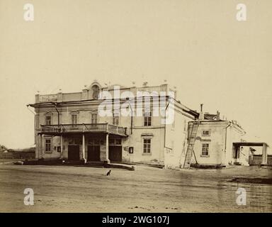 Irkutsk Theatre, 1880-1889. From an album of photographs and prints showing highlights of the city of Irkutsk and its surrounding region in the late 19th century. Irkutsk was at that time the center of Siberian cultural and intellectual life. The buildings shown include the Museum of Regional Studies, a technical school, orphanage, hotels, and the Church of Our Lady of Kazan. Other photographs in the album show the suburb of Glazkovo and villages in the Irkutsk region, including one on the shores of Lake Baikal. The album also includes photographs of the native Buriat people, who are Buddhist, Stock Photo