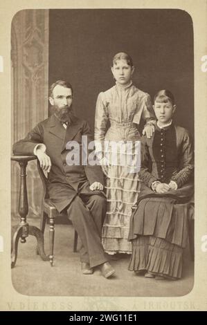 Family portrait of an unidentified man and his two daughters, 1885. Inscription in Russian on the verso: By heart to mister Kennan. M. Ivesherov. Chita. 28 November 1885. Stock Photo