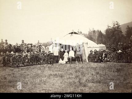 Group of Kirghiz (ie Kazakh) men posing with a local Russian Governor, his wife, and their child in front of a yurt, between 1885 and 1886. Showing Kazakhs posed by the nomadic dwelling called a yurt. Formerly misidentified as Kyrgyz people in Siberia. Stock Photo