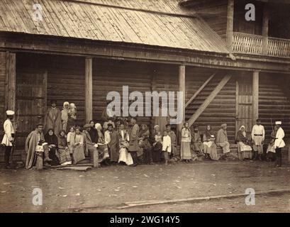 Hard Labor Convicts Visiting with Their Families, 1891. One of 74 views taken in July 1891 and contained in the albumTipy i vidy Nerchinskoi katorgi (Views and inhabitants of Nerchinsk hard labor camps). The Nerchinskkatorgawas part of the katorga (forced labor) system of imperial Russia, located in the province of Transbaikalia (present-day Zabaykal'skiy Kray), near the Russian border with China. The katorga was administered by the Ministry of Interior and included prisons at Akatuy, Kara, Aleksandrovsk, Nerchinskii Zavod, and Zerentuy, all of which are depicted in the album. National Library Stock Photo