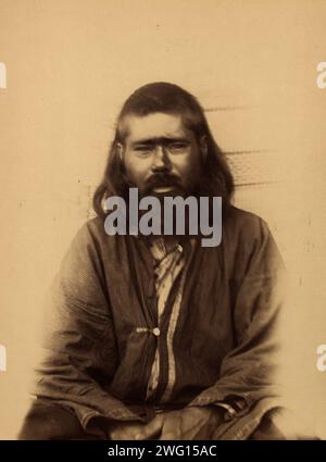 An Ainu from the Settlement of Penzenskoye in Southern Sakhalin, 1880-1899. From an album created on Sakhalin Island in the 1890s. Sakhalin was used by imperial Russia as a penal colony and place of exile for criminals and political prisoners. Between 1869 and 1906, more than 30,000 inmates and exiles endured the harsh conditions of the forced-labor colony on the island. The album contains photographs that provide rare glimpses of Sakhalin's settlements and prisons and the prisoners, exiles, and guards who inhabited the island.  Anton Chekhov, the Russian writer and medical doctor, spent three Stock Photo