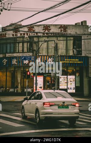 crossroad in Shanghai, China, in the background with Chinese signes Stock Photo