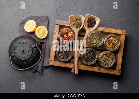 Tea time assortment: Various dry tea leaves. Flat lay Stock Photo