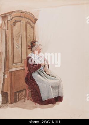 Apparel - Handicraft woman in full figure sitting in front of a cupboard. (c1900s). Stock Photo