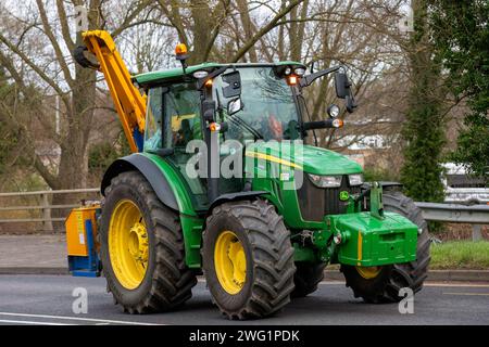 Milton Keynes,UK 31st jan 2024. John Deere 5125 R tractor travelling on an English road Stock Photo
