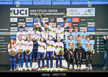 Tabor, Czech Republic. 02nd Feb, 2024. Mixed relay during the UCI Cyclo-cross World Championships in Tabor, Czech Republic, on February 2, 2024. The winning team of France on the podium (centre) and team of Great Britain (left) and Belgium (right). Credit: Vaclav Pancer/CTK Photo/Alamy Live News Stock Photo