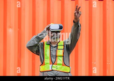 Worker Using VR Vision Pro Technology Equipment Headset Device Work at Container Yard Construction site Innovation in Logistics Industry Stock Photo