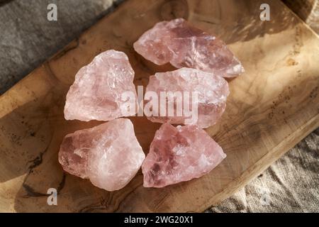 Rose quartz stones on a table Stock Photo
