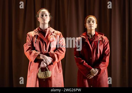 l-r: Eleanor Dennis (Ofglen), Kate Lindsey (Offred) in THE HANDMAID'S TALE at English National Opera (ENO), London Coliseum, London WC2  01/02/2024  music: Poul Ruders  libretto: Paul Bentley after the novel by Margaret Atwood  conductor: Joana Carneiro  design: Annemarie Woods  video design: Akhila Krishnan  original lighting: Paule Constable  original movement & intimacy coordinator: Imogen Knight  director: Annilese Miskimmon Stock Photo