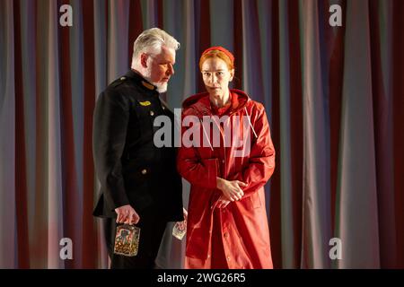 James Creswell (The Commander), Kate Lindsey (Offred) in THE HANDMAID'S TALE at English National Opera (ENO), London Coliseum, London WC2  01/02/2024  music: Poul Ruders  libretto: Paul Bentley after the novel by Margaret Atwood  conductor: Joana Carneiro  design: Annemarie Woods  video design: Akhila Krishnan  original lighting: Paule Constable  original movement & intimacy coordinator: Imogen Knight  director: Annilese Miskimmon Stock Photo