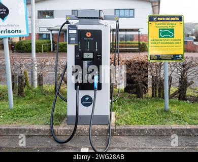 A single Sea Charger EV charging station in Morrisons supermarket car park in Teignmouth, Devon with a maximum stay of 3 hours. Stock Photo
