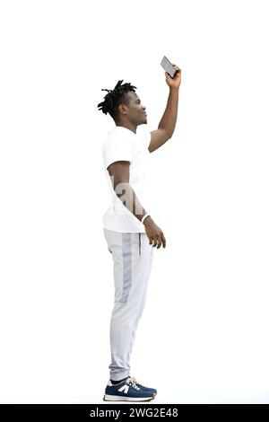 A man, full-length, on a white background, waving his phone Stock Photo