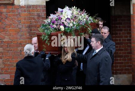 London, UK. 2nd Feb, 2024. Pallbearers carry the coffin from the church. His daughter, Darcey(front right) carries the coffin. The funeral of Derek Draper, husband of Kate Garraway, at the Church of St Mary the Virgin, Primrose Hill. Derek Draper died on 3rd January 2024. Credit: Karl Black/Alamy Live News Stock Photo