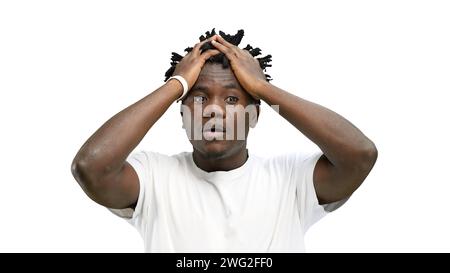 A man, close-up, on a white background, clutched his head Stock Photo