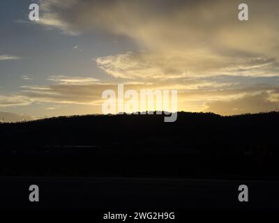 Sunrise over hill and cloud from apartment window Stock Photo