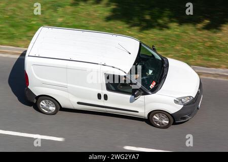 OSTRAVA, CZECH REPUBLIC - AUGUST 23, 2023: White Fiat Doblo van, motion blur effect when delivering goods Stock Photo