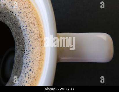 macro photo of espresso foam in white cup Stock Photo