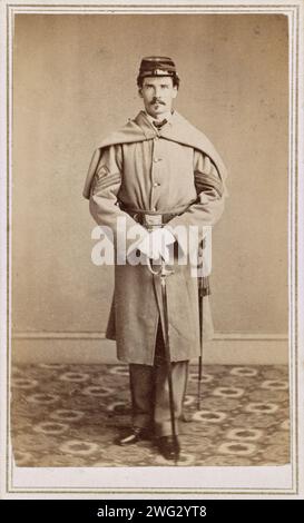 Carte de visite photograoh of an Unidentified soldier in Union sergeant's uniform with sword. Created / Published J. Taylor's Photographic Studio. circa 1860s  Library of Congress Prints and Photographs Division Washington, D.C. 20540 USA Stock Photo