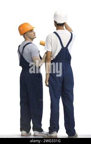 Two builders, on a white background, in full height Stock Photo