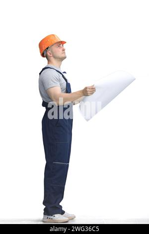 Builder, on a white background, full-length, with a drawing Stock Photo