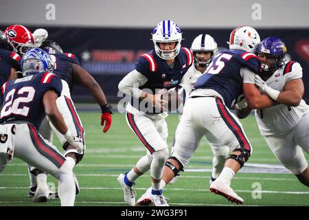 Brigham Young quarterback Kedon Slovis runs a drill at the NFL football ...