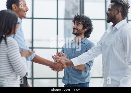 Successful Business Collaboration: Executives Greet with Handshake in Office Stock Photo