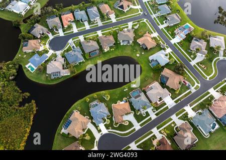 Low-density private homes. Rural street cul-de-sac dead end in residential suburbs with upscale suburban houses outside of Sarasota, Florida Stock Photo