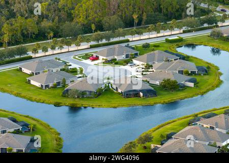 American dream homes on rural cul-de-sac street in US suburbs. View from above of waterfront residential houses in living area in North Port, Florida Stock Photo