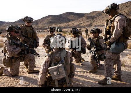 U.S. Marine Corps Sgt. Jonas Hill, a team leader with Kilo Company, 3rd Battalion, 4th Marine Regiment, 1st Marine Division, briefs his squad brief during National Training Center Rotation 24-03 at Fort Irwin, California, Jan. 18, 2024. The exercise provided Marines and Sailors an opportunity to sustain training in primary conventional combat operations against a peer competitor. (U.S. Marine Corps photo by Cpl. Brayden Daniel) Stock Photo